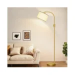 Gold Modern Arc Floor Lamp with natural linen drum shade standing in a living room