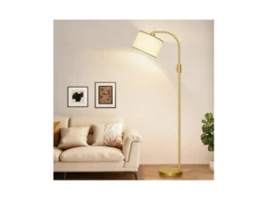 Gold Modern Arc Floor Lamp with natural linen drum shade standing in a living room