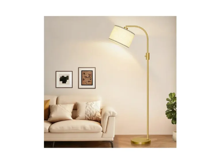 Gold Modern Arc Floor Lamp with natural linen drum shade standing in a living room