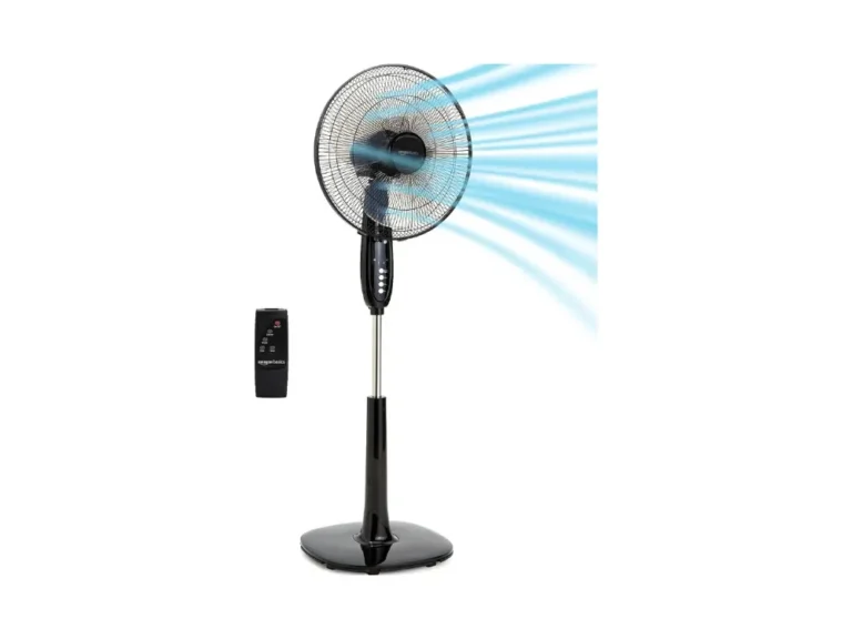 Black Amazon Basics 16-Inch Pedestal Fan standing in a modern living room corner